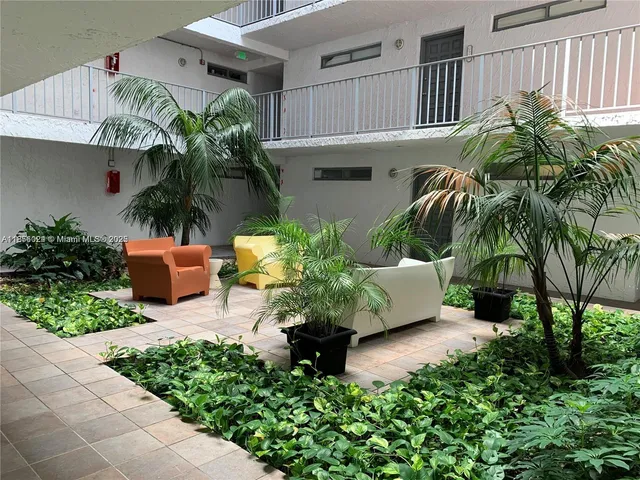 a view of a house with a tree