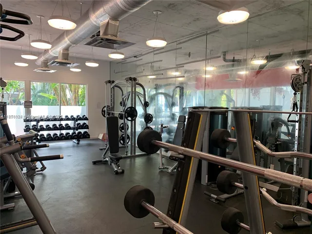 a view of backyard with swimming pool and outdoor seating