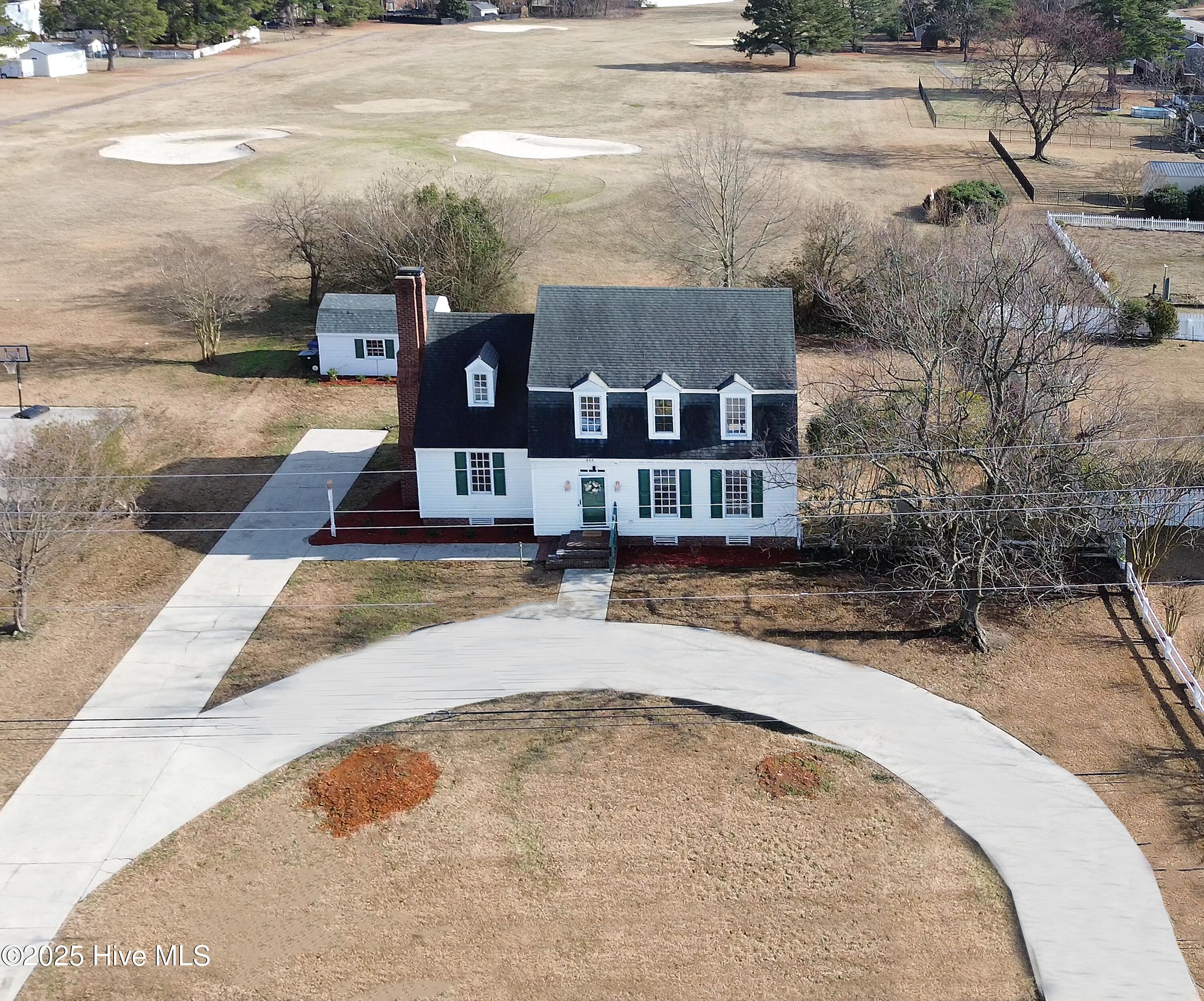 Overlooks the 3rd green! Nice back yard and circular driveway for extra parking!
