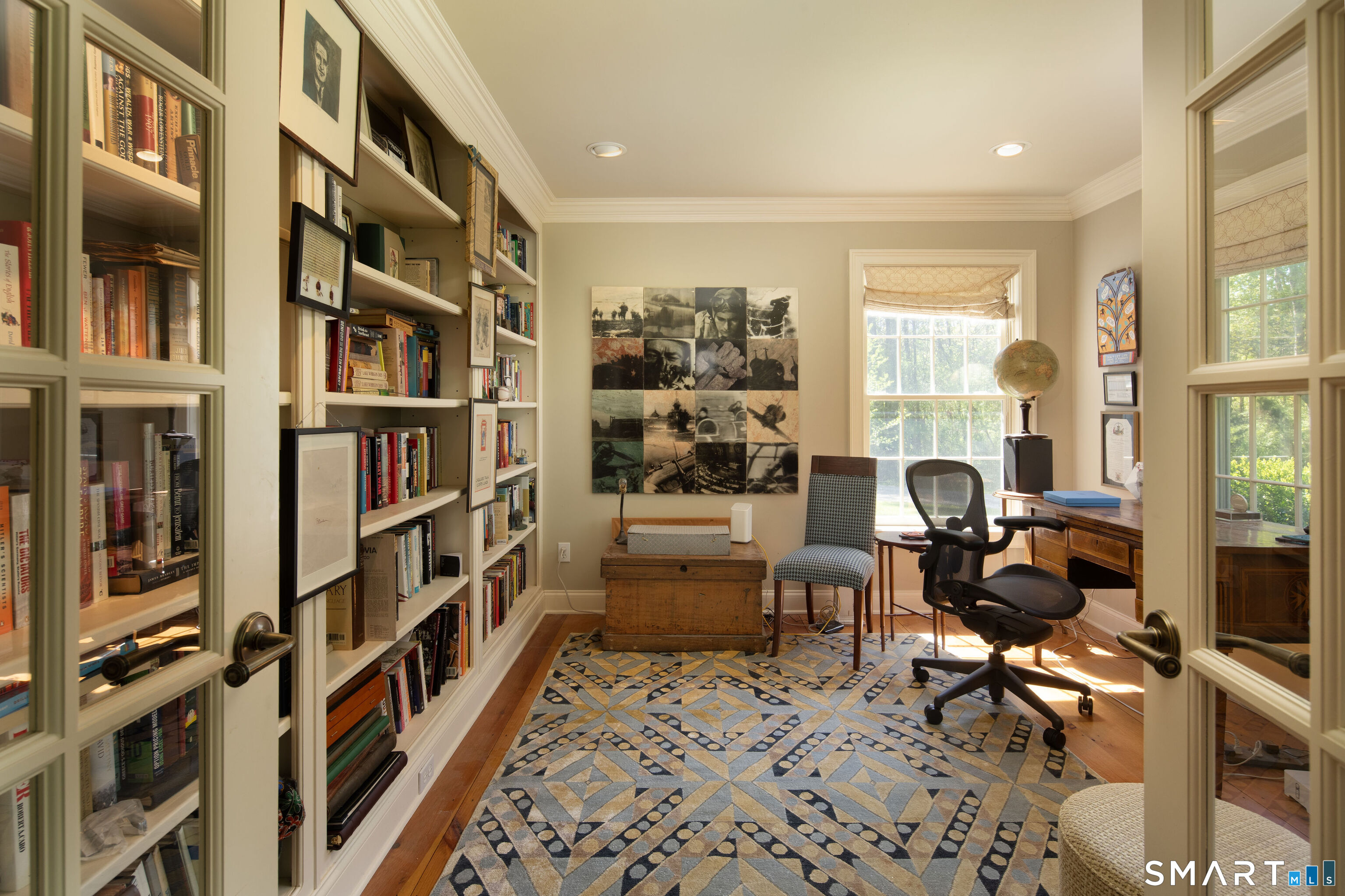7 Cooper Hill Road Salisbury, CT 06068 - Photo 21 of 36 a room with furniture and a book shelf