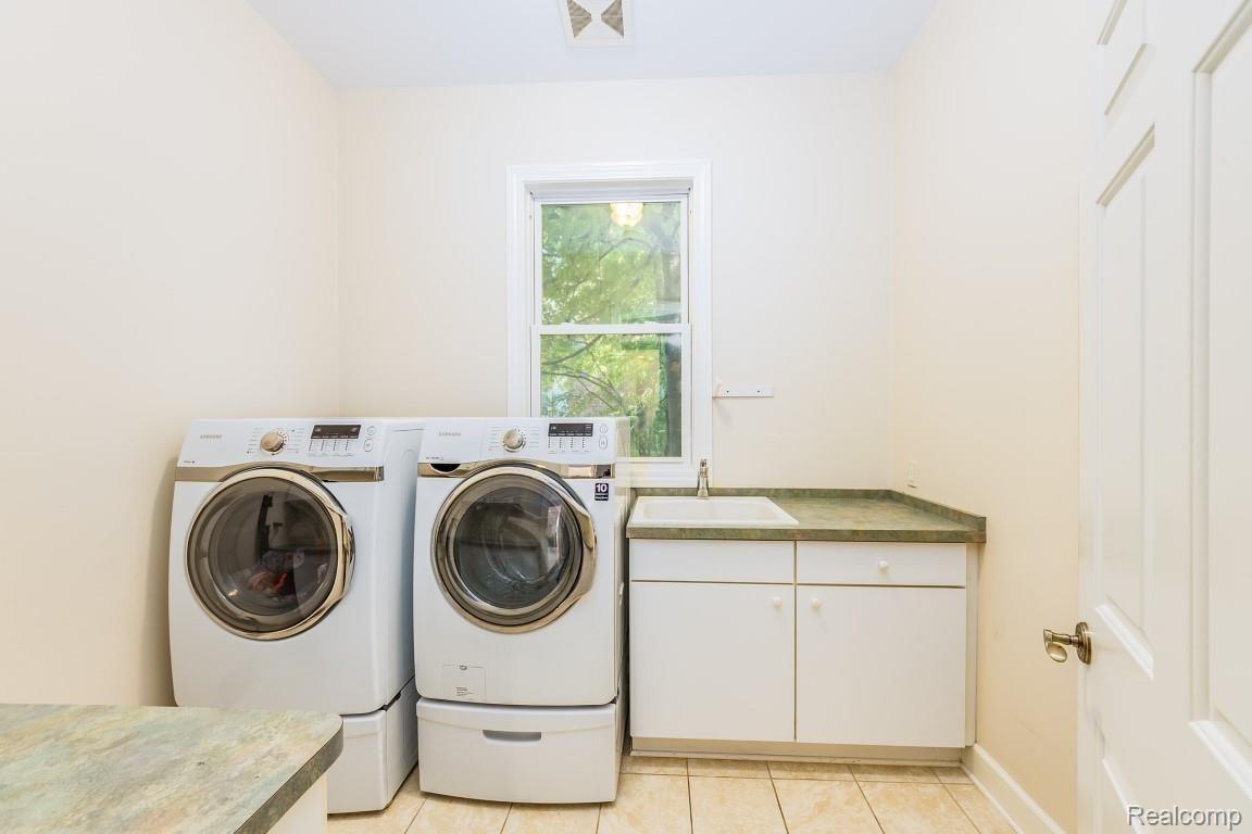 26900 Drake Road Farmington, MI 48331 - Photo 16 of 46 First floor laundry with tub and counter space