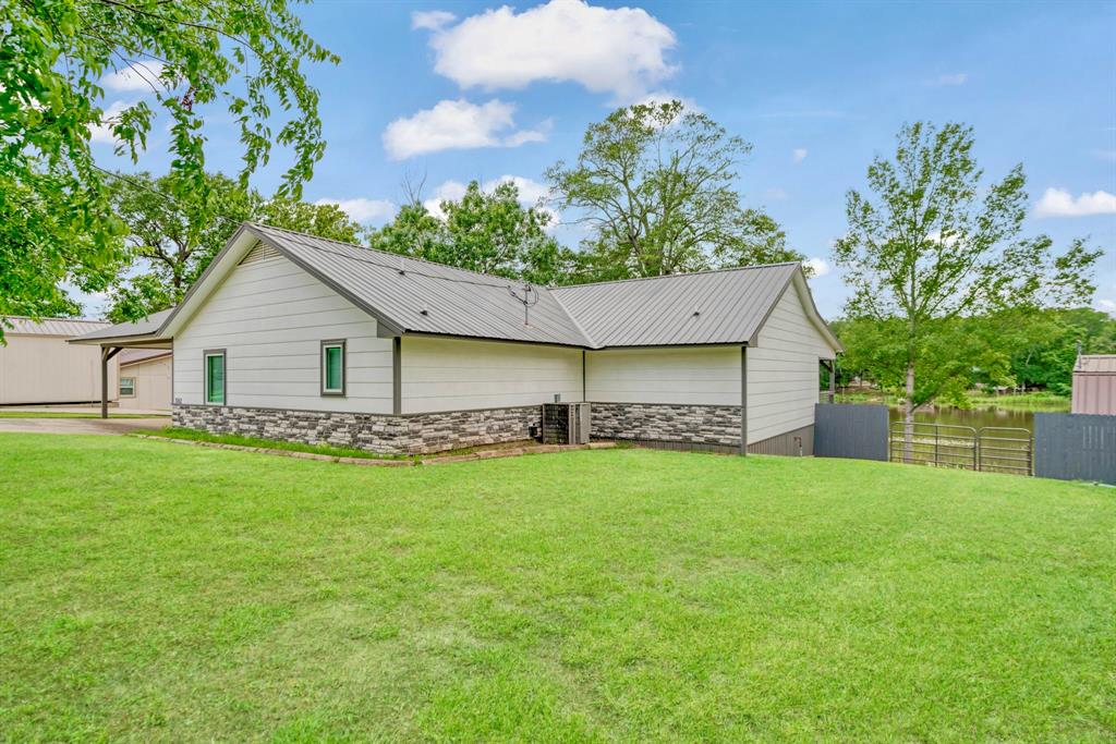 1205 Lakeside Drive Fort Towson, OK 74735 - Photo 1 of 38 a view of a house with a backyard