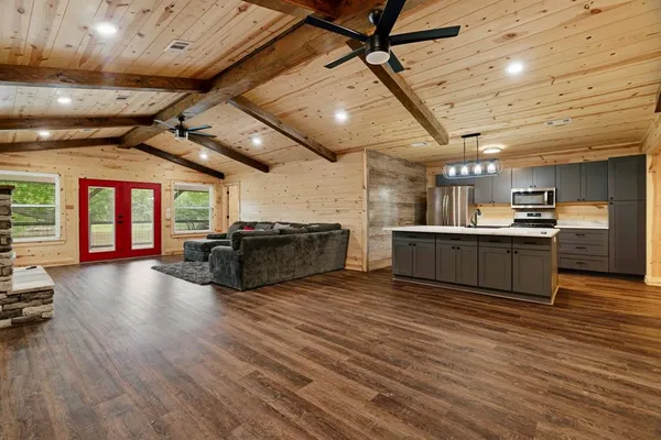 a view of kitchen with cabinets and wooden floor