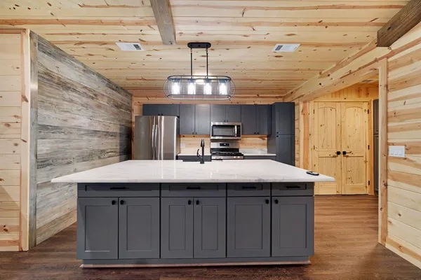 a kitchen with a sink and cabinets