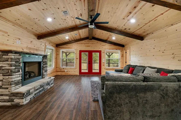 a living room with furniture fireplace and flat screen tv