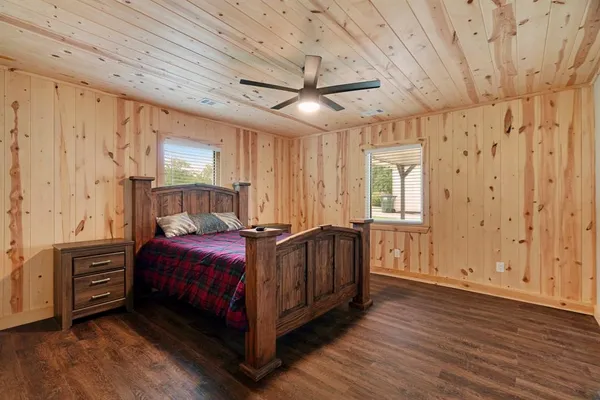 a bedroom with a bed and a dresser