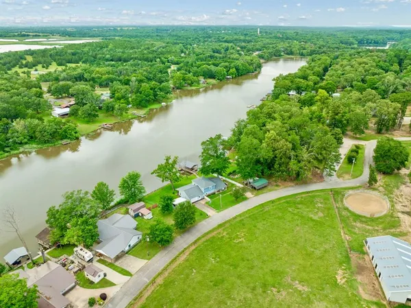 a view of a lake with a yard