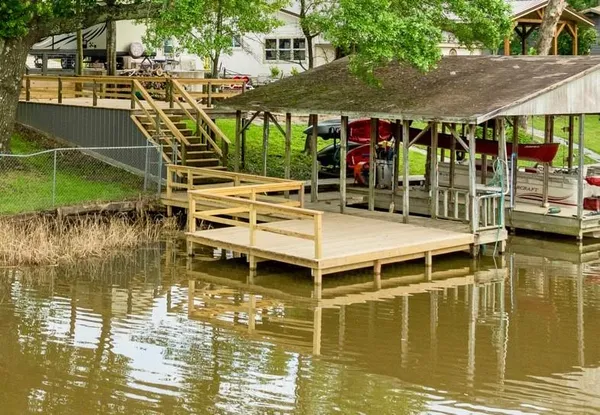 a swimming pool with outdoor seating and yard