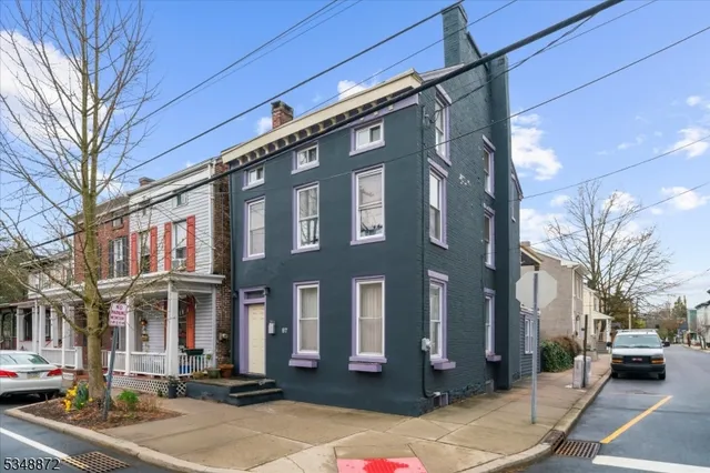 a city street lined with buildings and cars