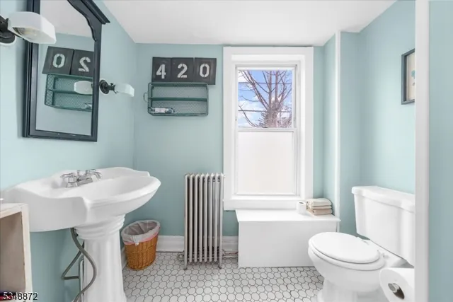 a bathroom with a toilet a sink and a bath tub