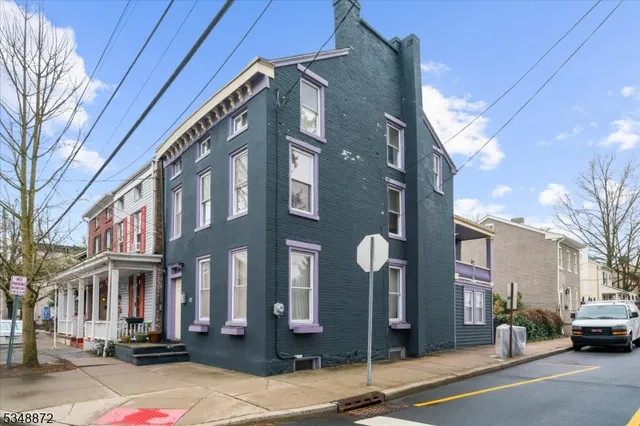 a city street lined with buildings and cars