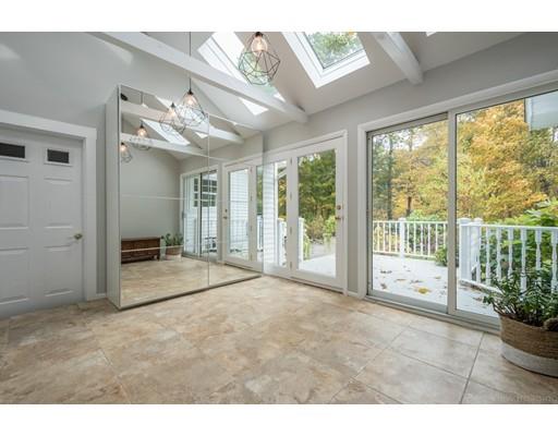 61 Maynard Road Sudbury, MA 01776 - Photo 5 of 38 a big room with wooden floor and windows