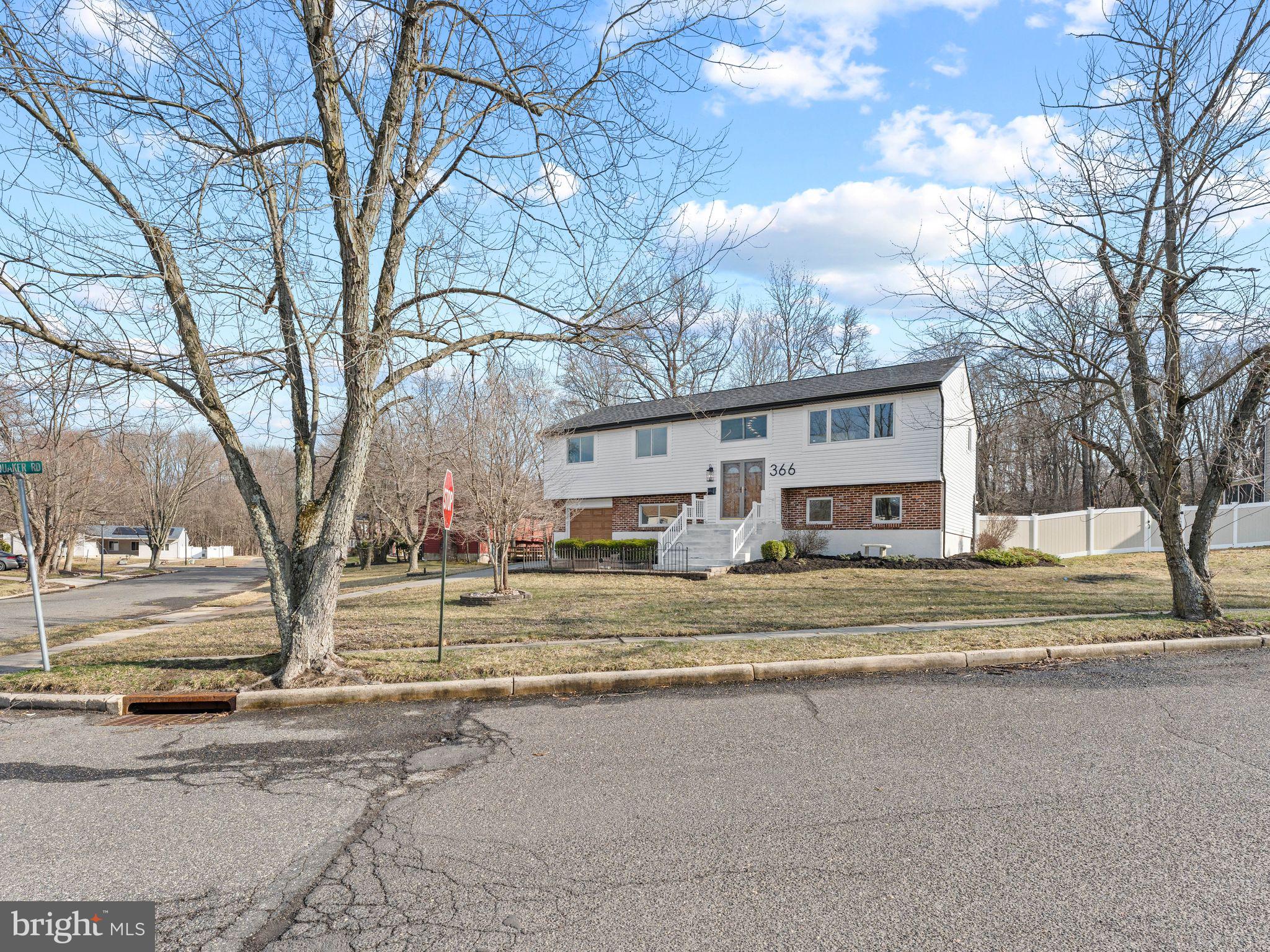 366 Independence Boulevard Lawnside, NJ 08045 - Photo 12 of 41 a view of a house with a yard and large trees