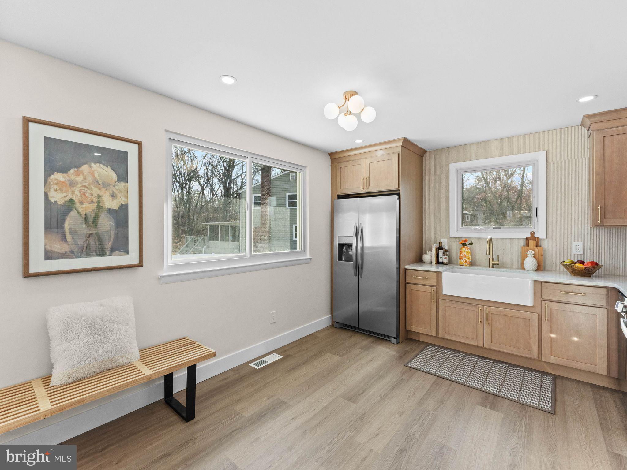 366 Independence Boulevard Lawnside, NJ 08045 - Photo 16 of 41 a kitchen with stainless steel appliances wooden floor and a refrigerator