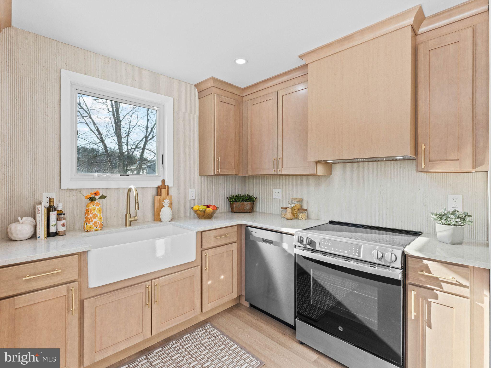 366 Independence Boulevard Lawnside, NJ 08045 - Photo 17 of 41 a kitchen with white cabinets white stainless steel appliances and sink