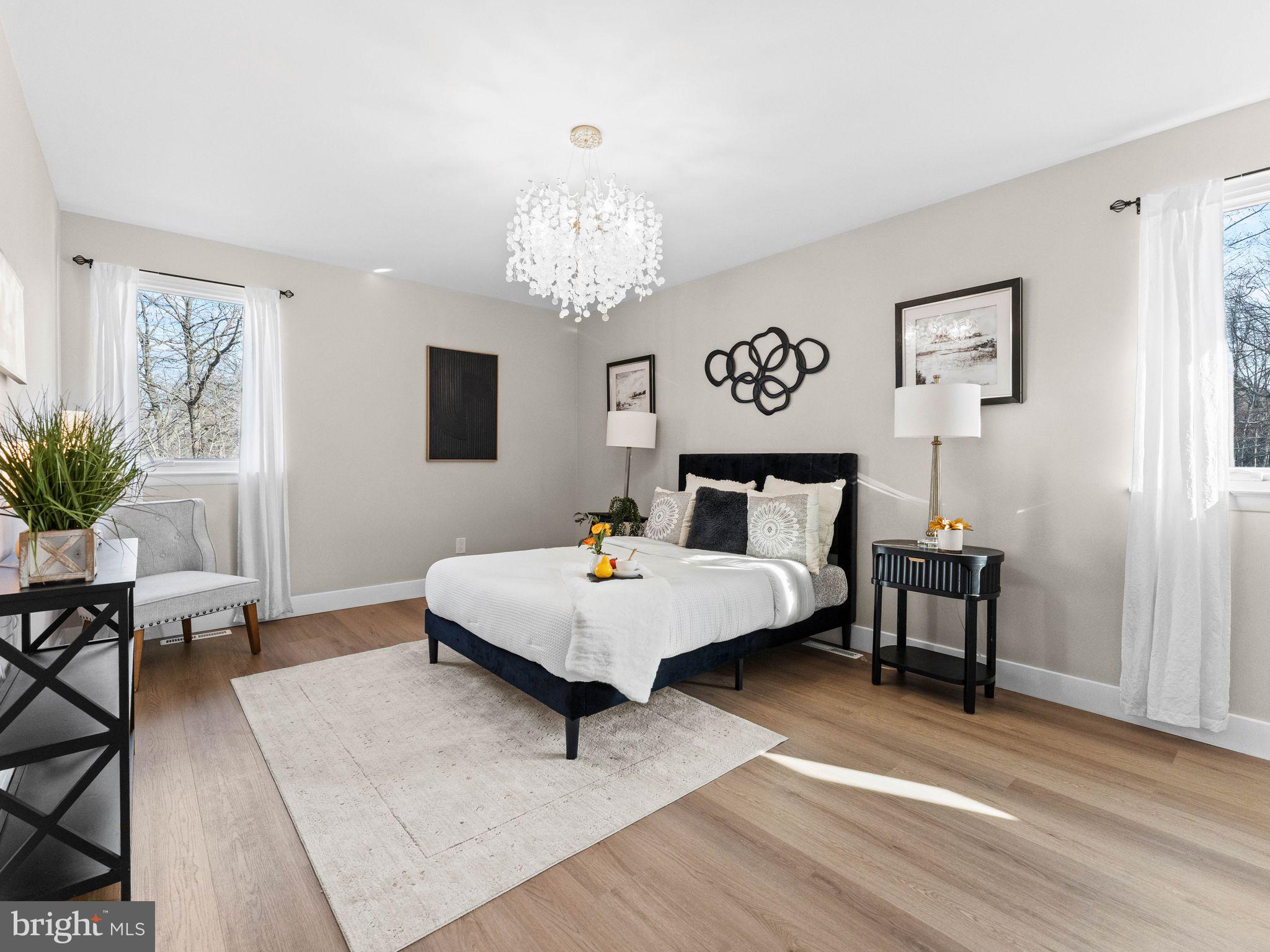 366 Independence Boulevard Lawnside, NJ 08045 - Photo 19 of 41 a living room with furniture and a chandelier