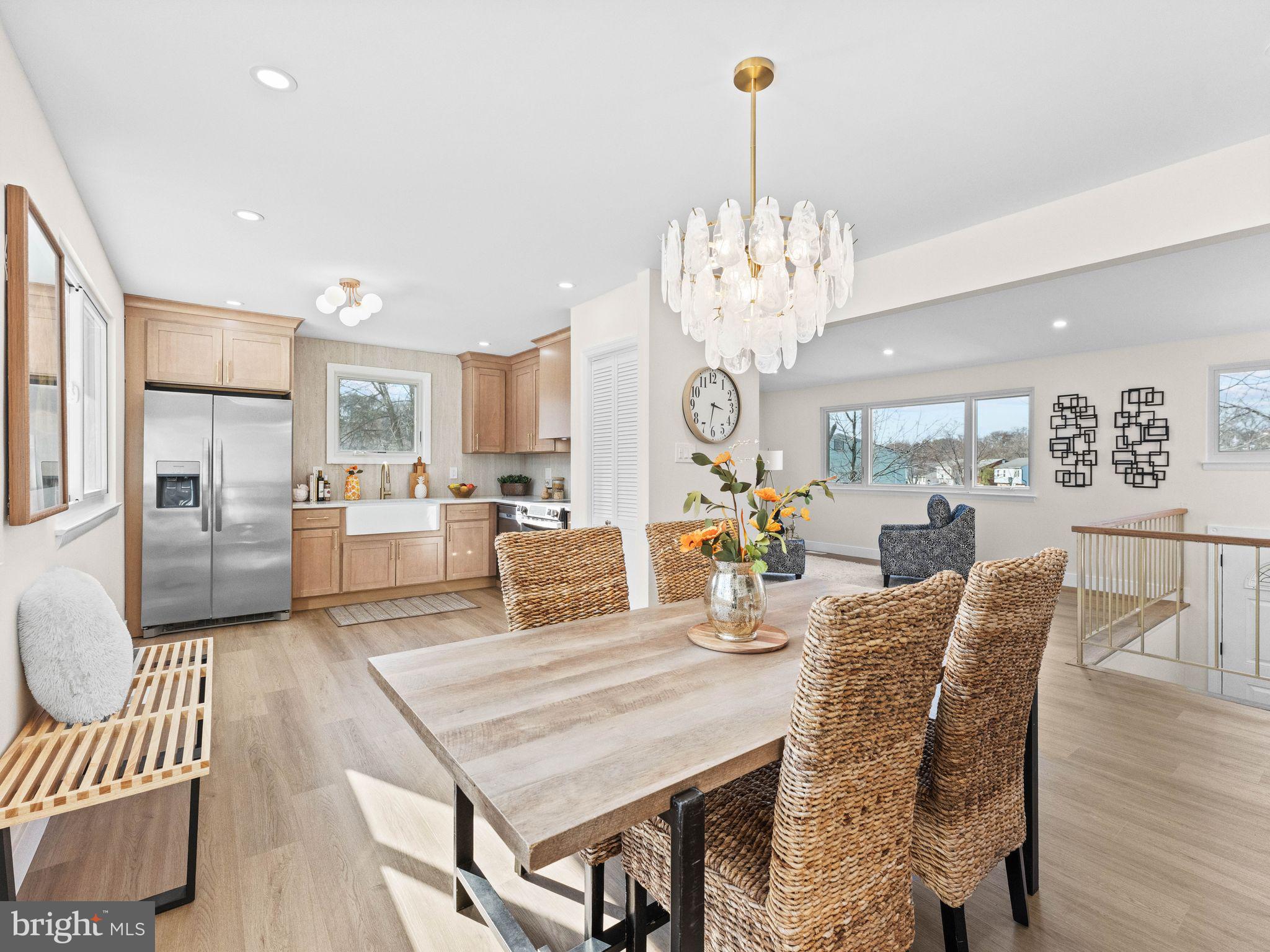 366 Independence Boulevard Lawnside, NJ 08045 - Photo 2 of 41 a view of a dining room and livingroom with furniture wooden floor a chandelier