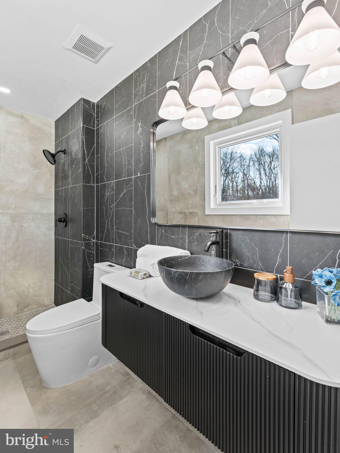 366 Independence Boulevard Lawnside, NJ 08045 - Photo 21 of 41 a bathroom with a sink and a mirror