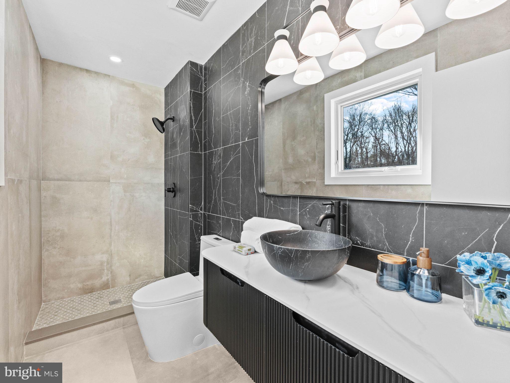 366 Independence Boulevard Lawnside, NJ 08045 - Photo 22 of 41 a bathroom with a sink mirror and toilet