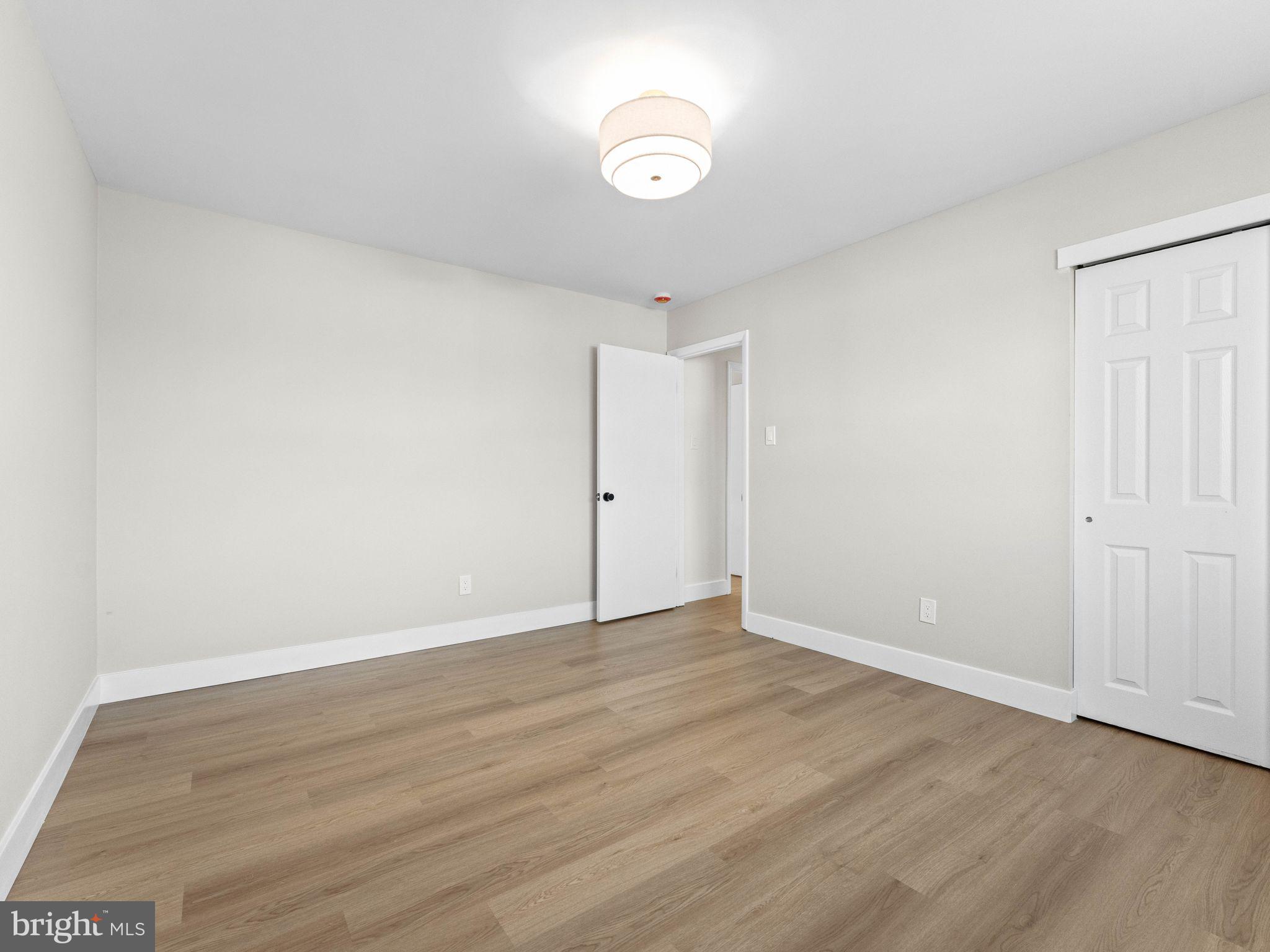 366 Independence Boulevard Lawnside, NJ 08045 - Photo 24 of 41 a view of an empty room with wooden floor and a window