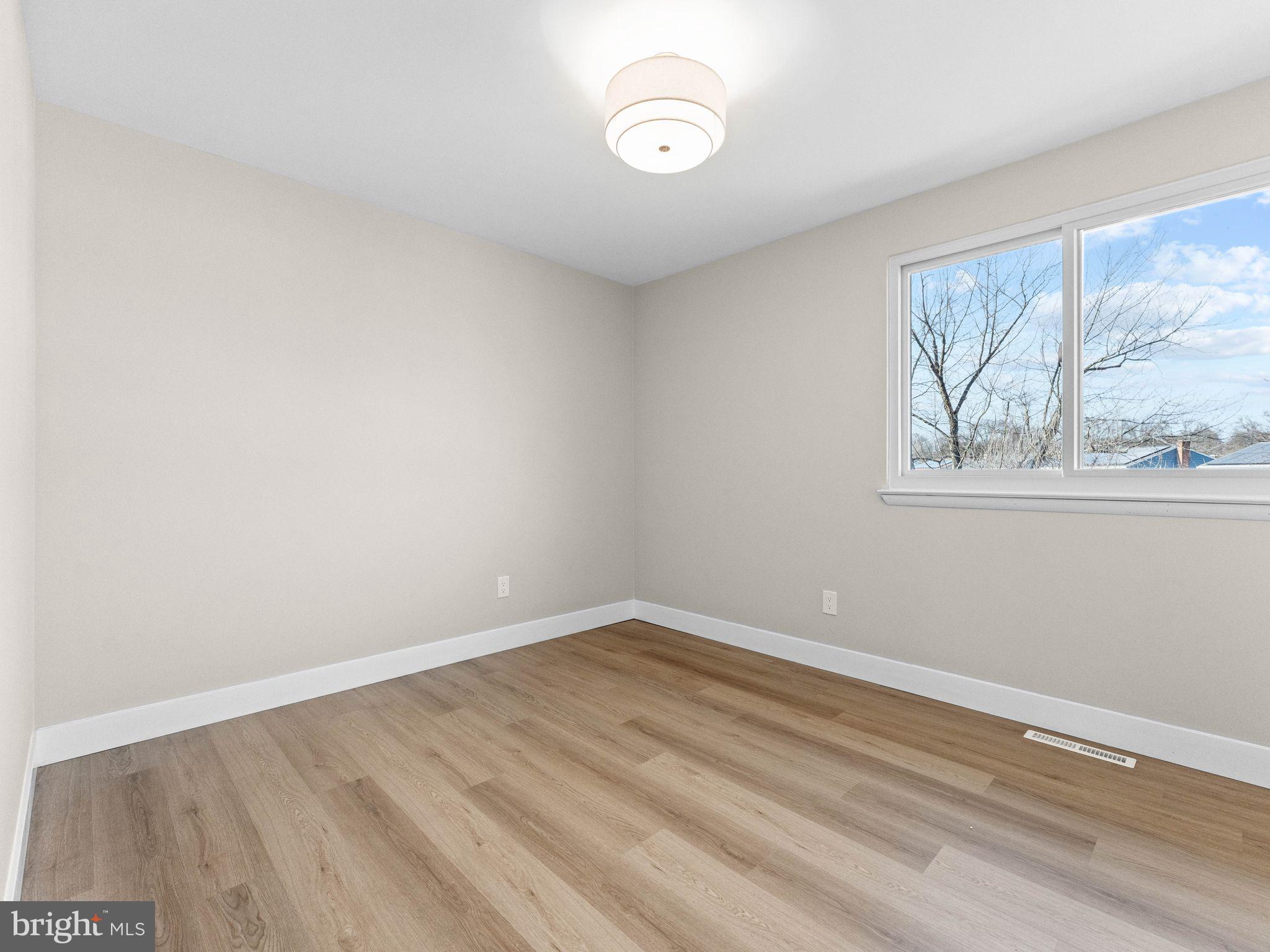 366 Independence Boulevard Lawnside, NJ 08045 - Photo 25 of 41 wooden floor in an empty room with a window