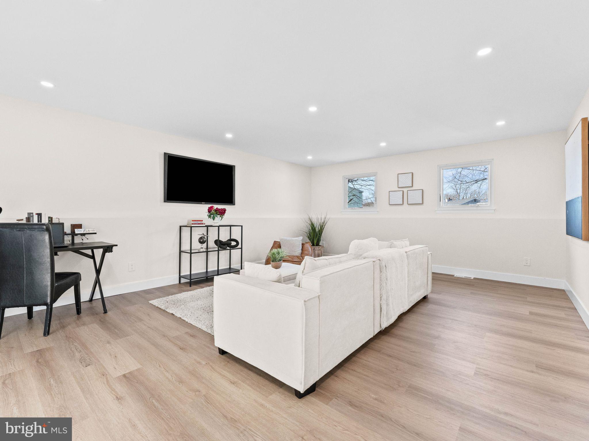 366 Independence Boulevard Lawnside, NJ 08045 - Photo 29 of 41 a living room with furniture and a flat screen tv