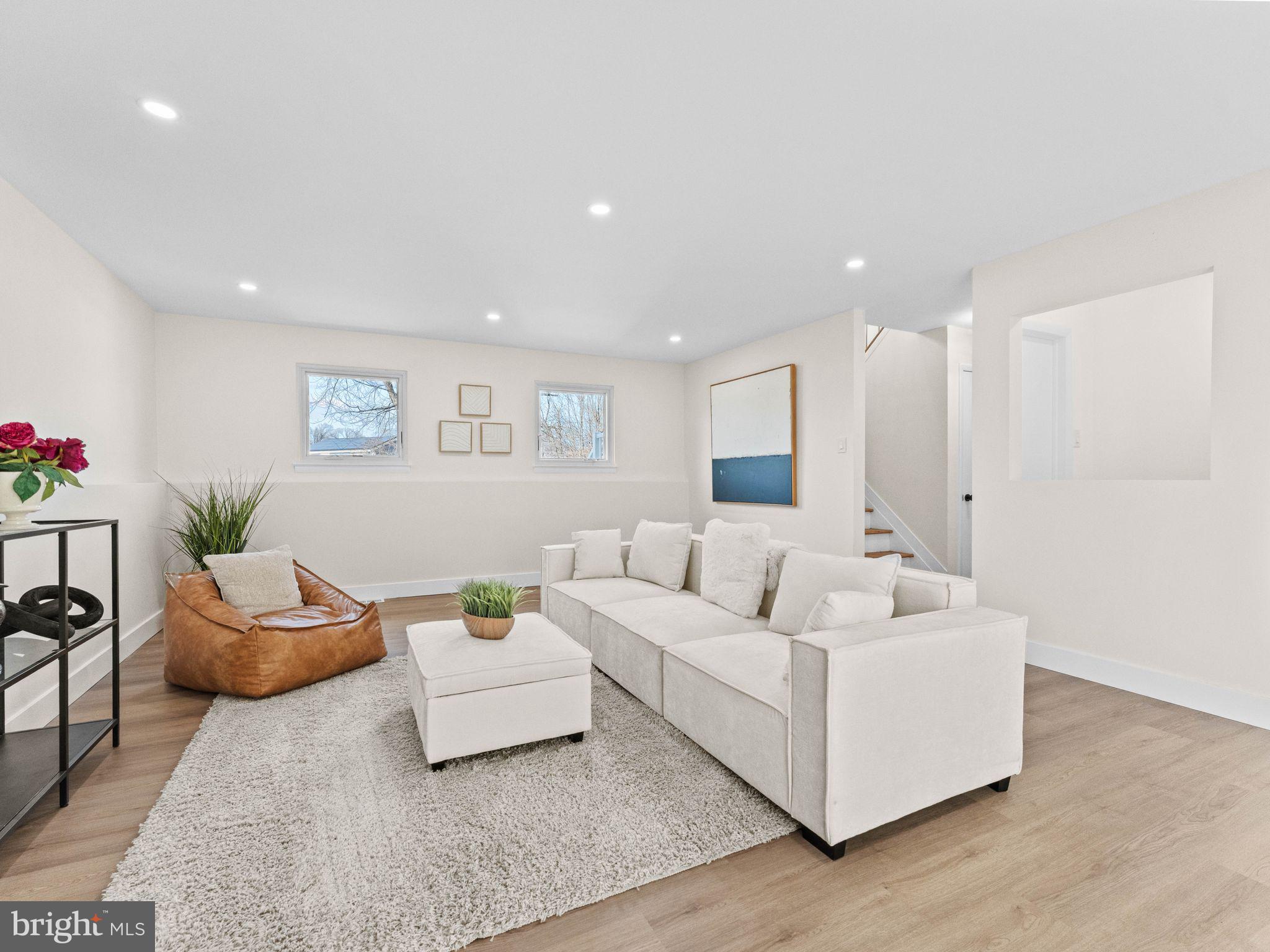366 Independence Boulevard Lawnside, NJ 08045 - Photo 30 of 41 a living room with furniture and a potted plant