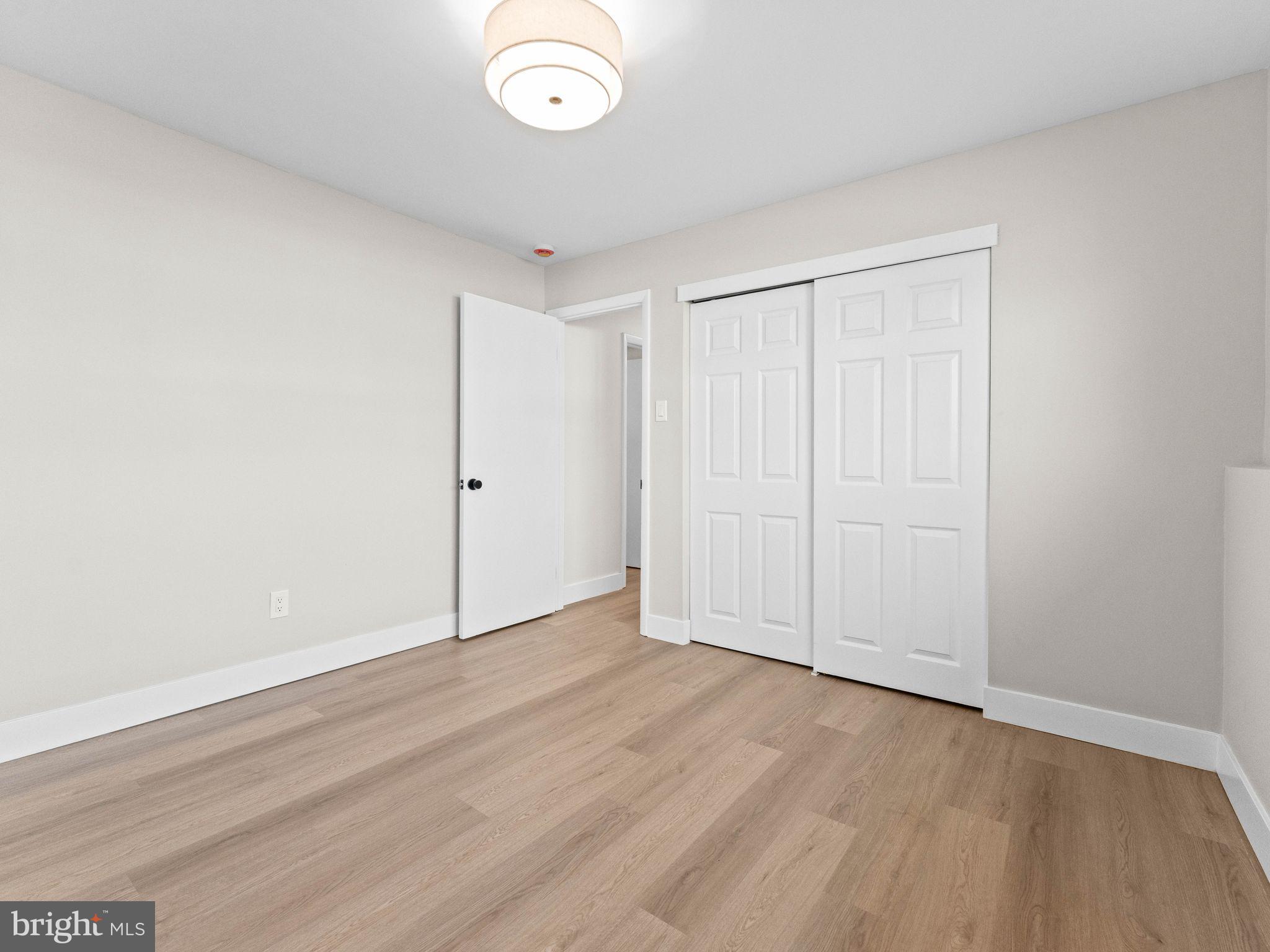 366 Independence Boulevard Lawnside, NJ 08045 - Photo 32 of 41 an empty room with wooden floor