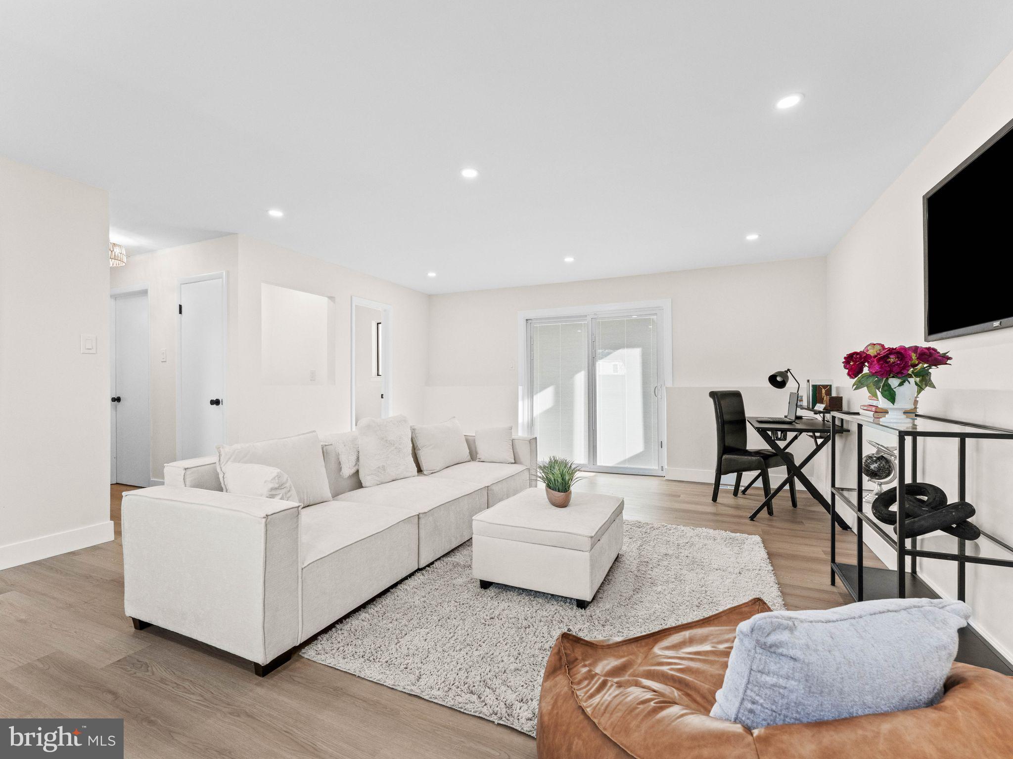 366 Independence Boulevard Lawnside, NJ 08045 - Photo 5 of 41 a living room with furniture and a flat screen tv