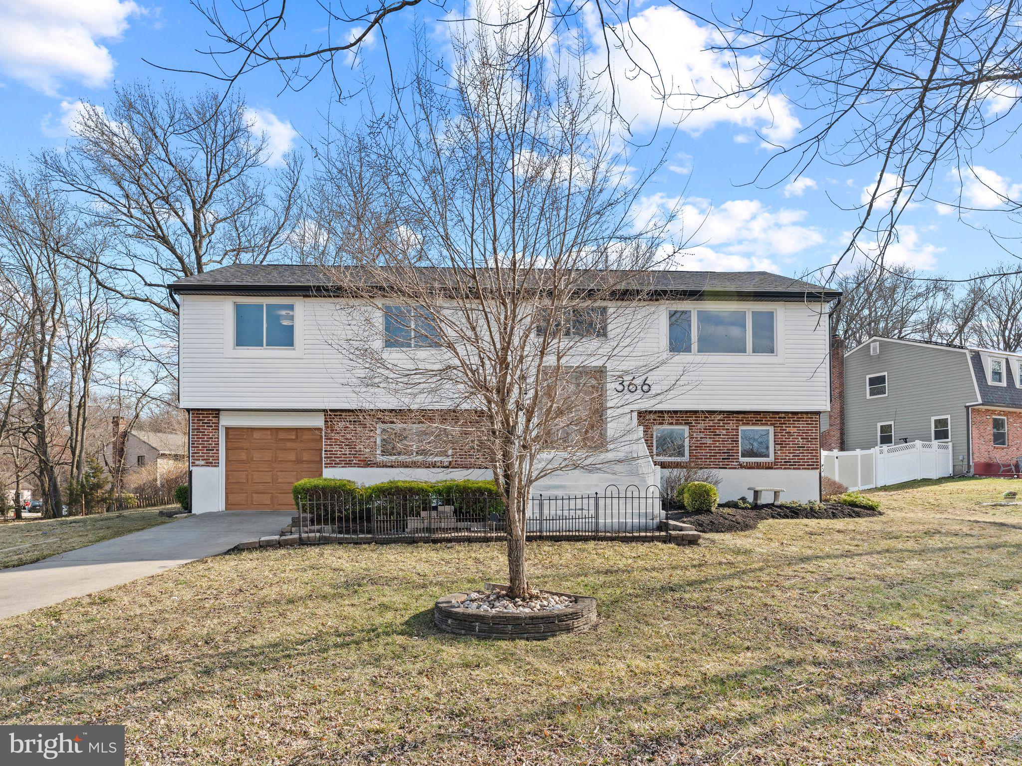366 Independence Boulevard Lawnside, NJ 08045 - Photo 8 of 41 a front view of a house with a yard