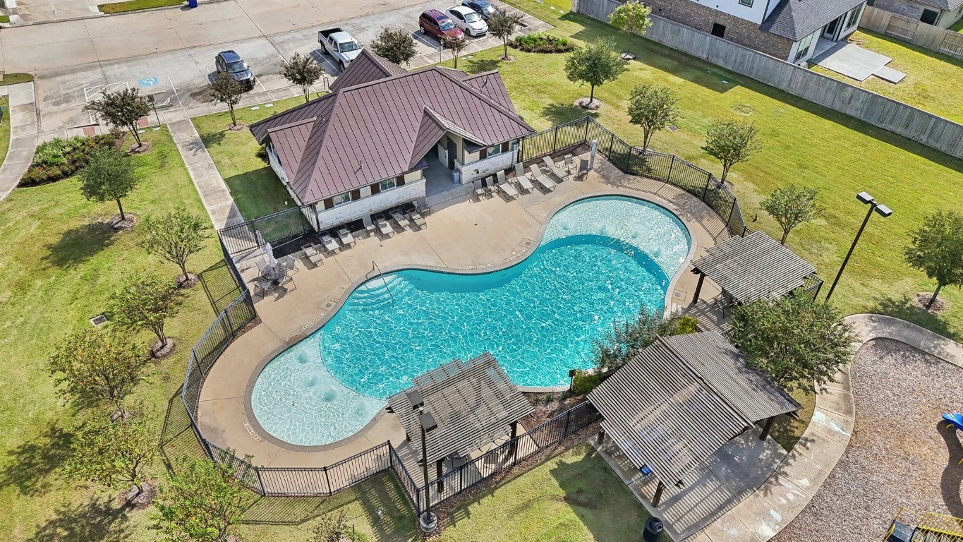 407 Summerset Landing Court Conroe, TX 77304 - Photo 12 of 15 an aerial view of a house having swimming pool