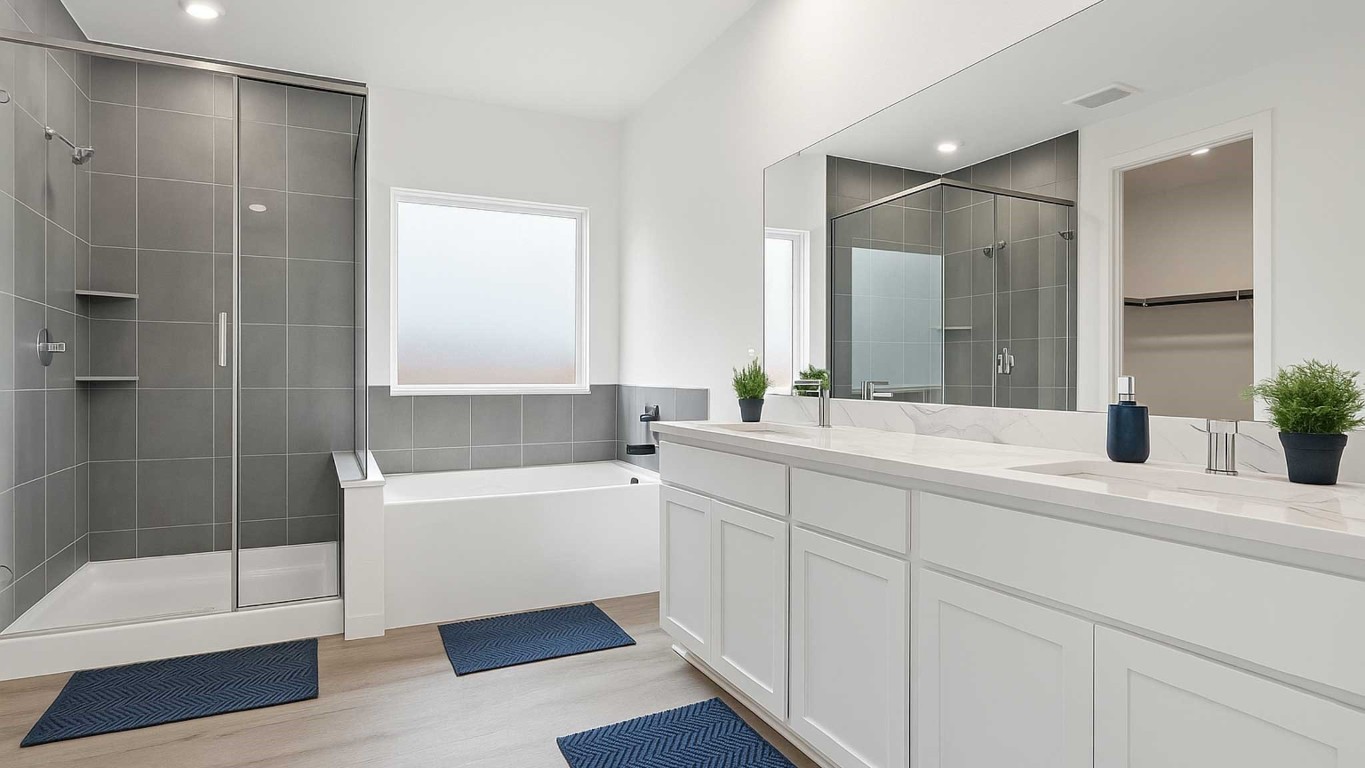 407 Summerset Landing Court Conroe, TX 77304 - Photo 4 of 15 a bathroom with a tub shower and sink