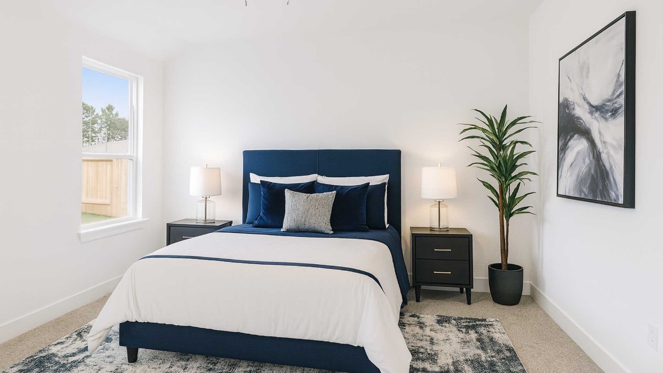 407 Summerset Landing Court Conroe, TX 77304 - Photo 5 of 15 a bedroom with a large bed and a potted plant