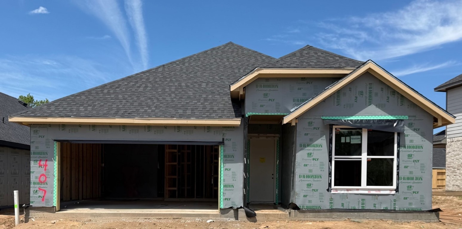 407 Summerset Landing Court Conroe, TX 77304 - Photo 7 of 15 a front view of a house with a garden