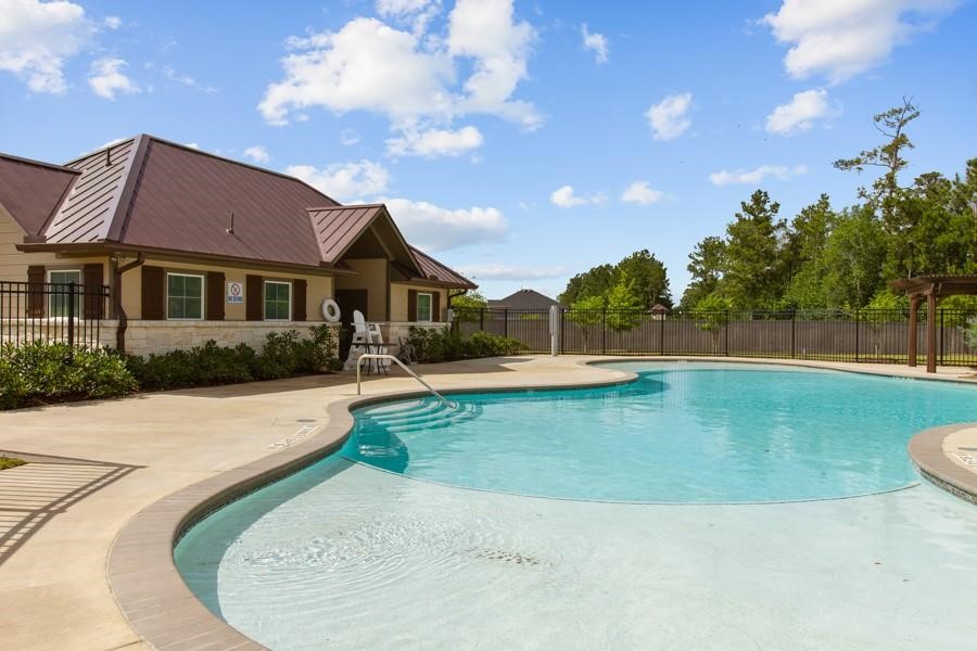 407 Summerset Landing Court Conroe, TX 77304 - Photo 10 of 15 a view of a house with swimming pool