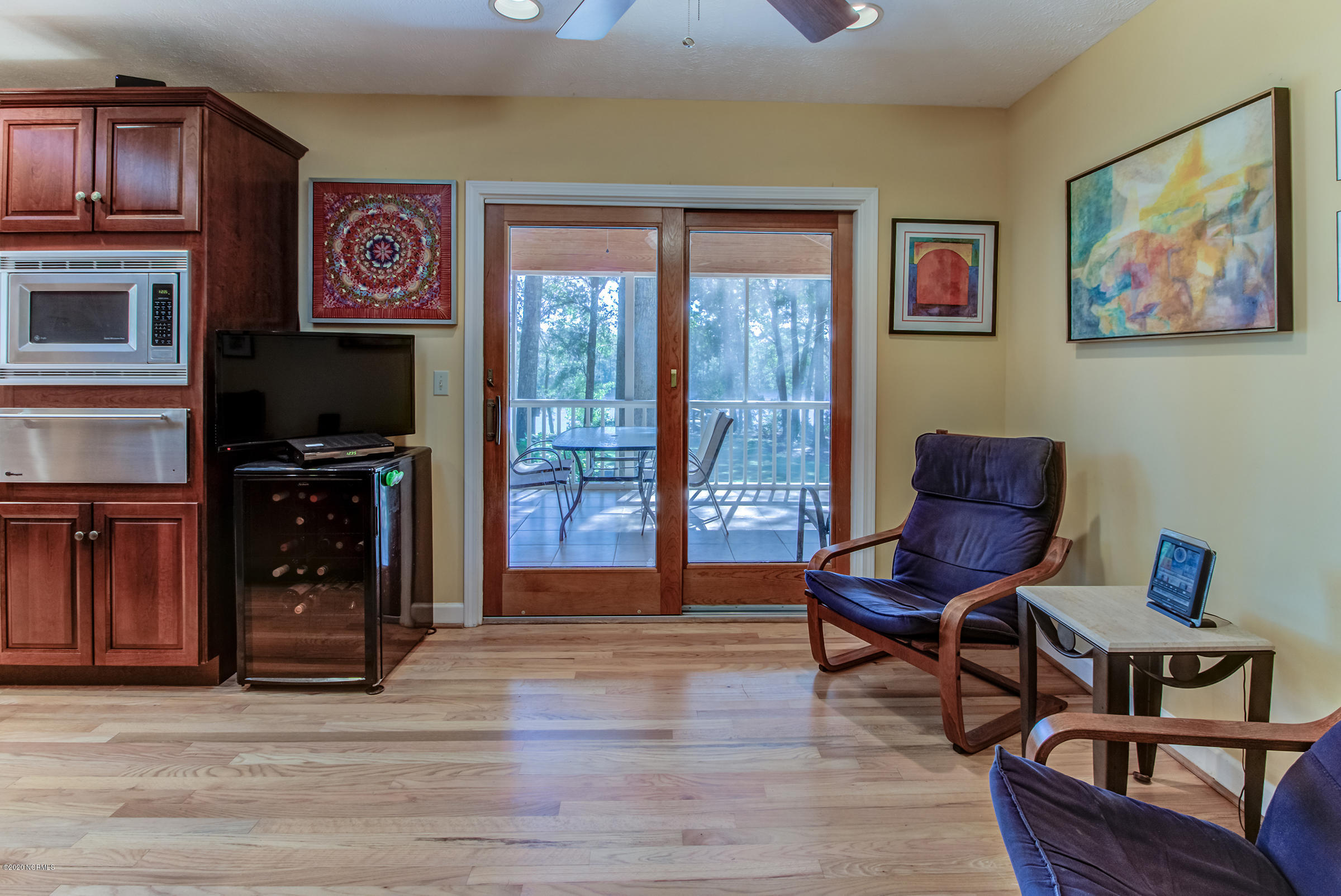 170 Goose Neck Road West Rocky Point, NC 28457 - Photo 14 of 46 Sliding doors to the screened-in porch