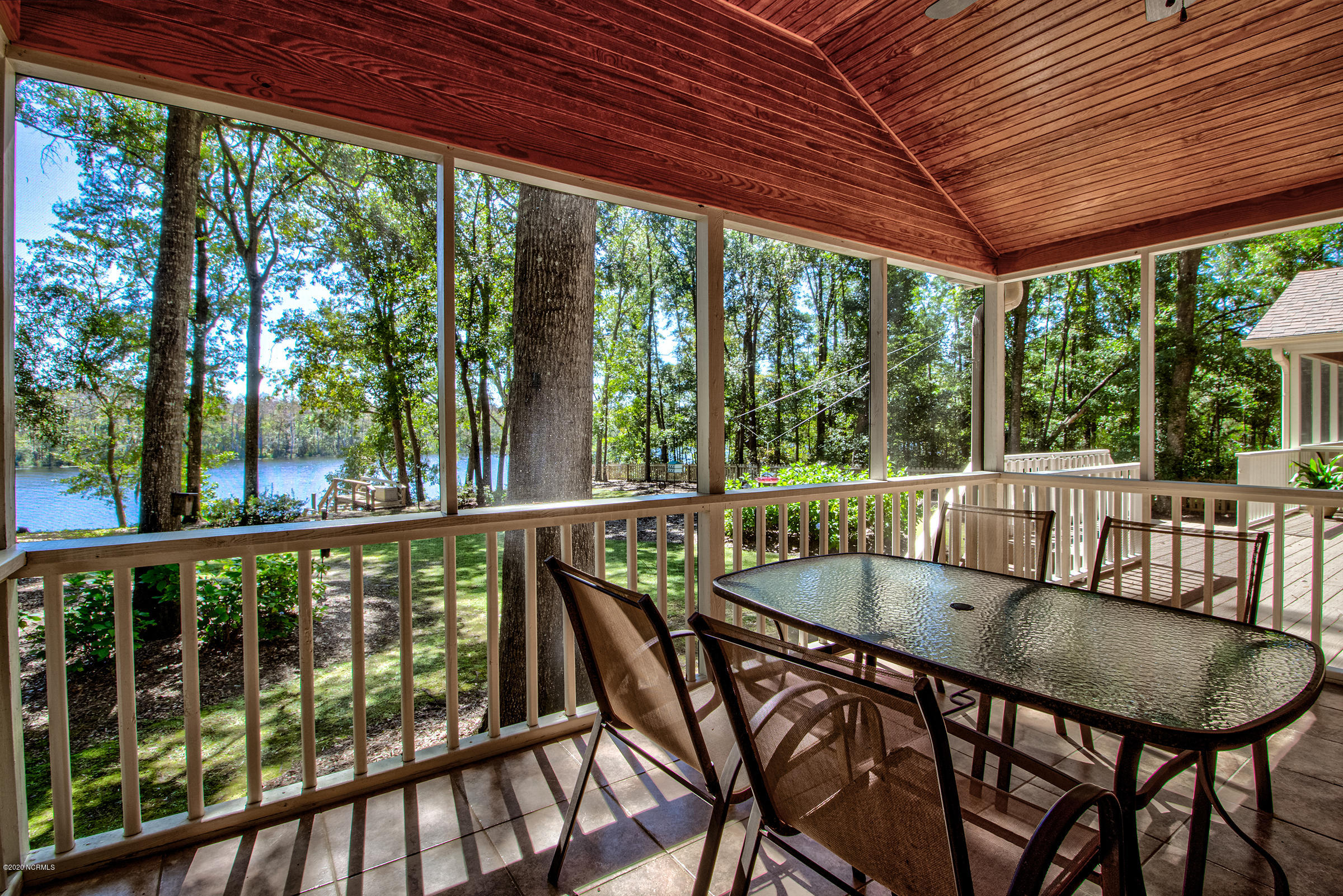 170 Goose Neck Road West Rocky Point, NC 28457 - Photo 15 of 46 Screened-in Porch off the kitchen