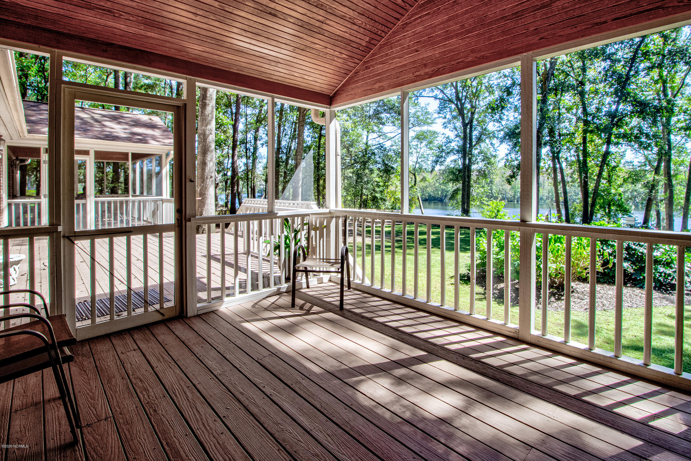 170 Goose Neck Road West Rocky Point, NC 28457 - Photo 20 of 46 Screened-in porch off the master bedroom