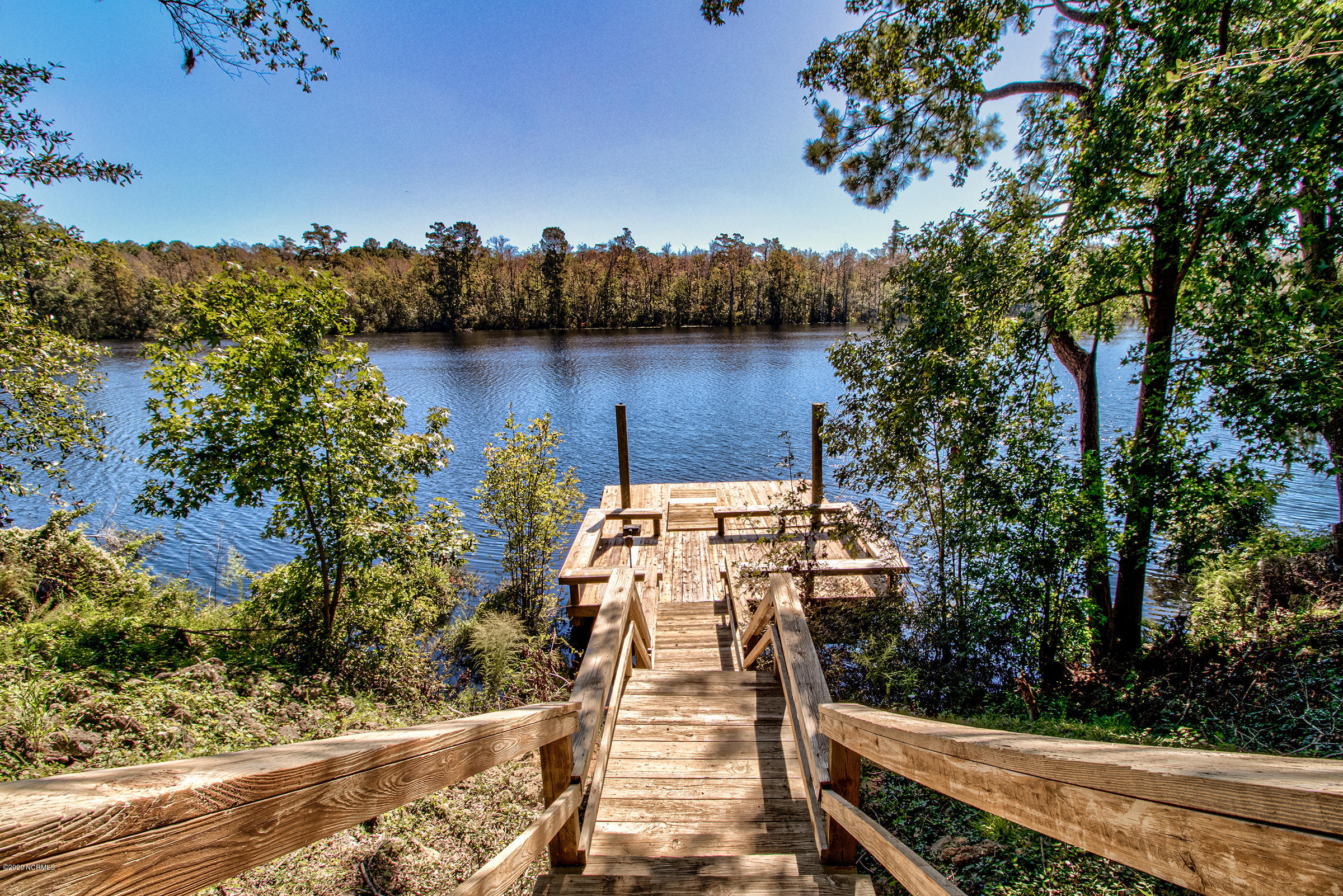 170 Goose Neck Road West Rocky Point, NC 28457 - Photo 29 of 46 Down a natural high bluff to the river! No manmade retaining wall to maintain.