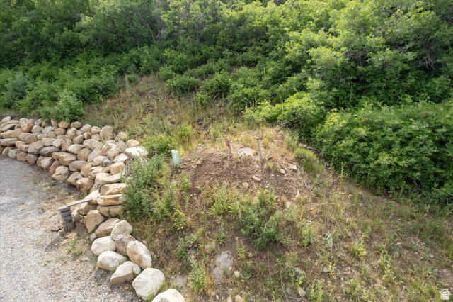 19845 North 14070 (north Fork Rd) Road East, Unit 313 Mount Pleasant, UT 84647 - Photo 19 of 39 The mound covers the 2,000 gallon underground water tank. See its pipes to the right of the stone retaining wall.
