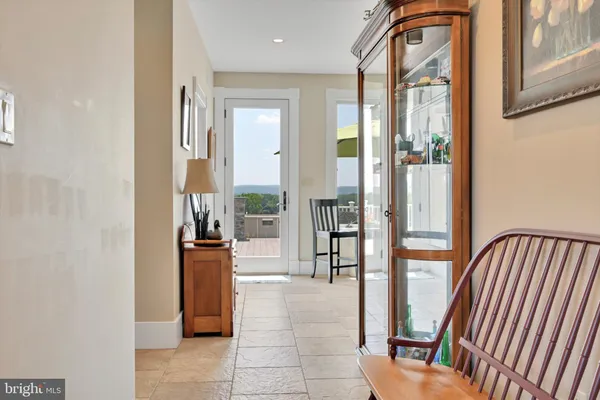 a kitchen with stainless steel appliances granite countertop a refrigerator a stove and a sink