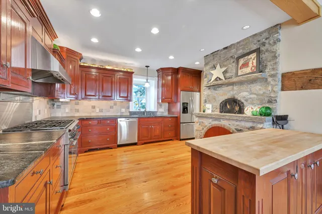 a bedroom with a bed and a dresser in it