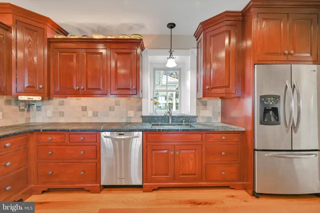 a bedroom with bed and wooden floor