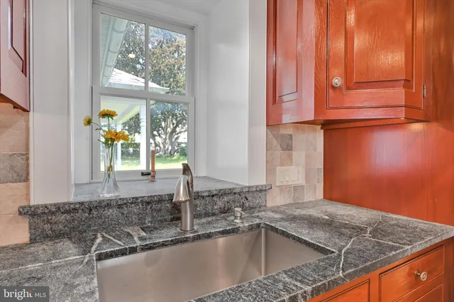 a view of a storage and utility room with washer and dryer