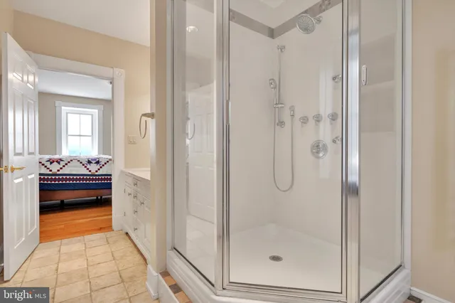 an aerial view of a house with garden space and lake view