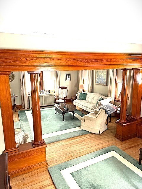 23 Nashua Street Ayer, MA 01432 - Photo 11 of 35 a living room with furniture and a floor to ceiling window