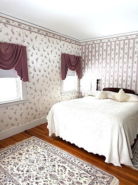 23 Nashua Street Ayer, MA 01432 - Photo 21 of 35 a bedroom with a bed and a window with the wooden floor