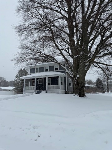 23 Nashua Street Ayer, MA 01432 - Photo 32 of 35 front view of house with a yard covered with snow