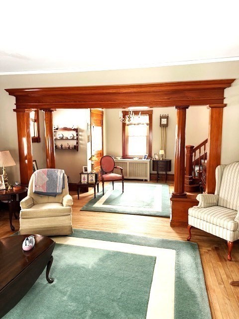 23 Nashua Street Ayer, MA 01432 - Photo 6 of 35 a living room with furniture and a floor to ceiling window