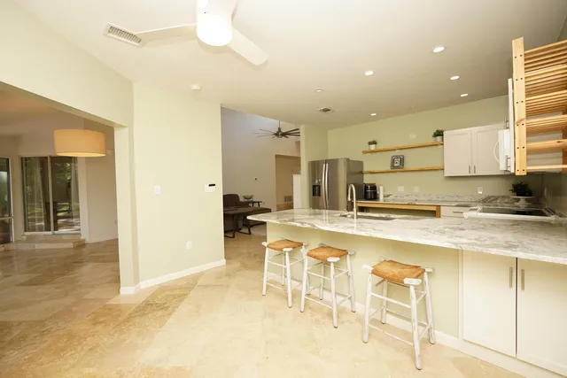 a kitchen with a sink cabinets and window